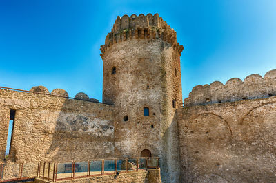 View of aragonese castle, aka le castella, on the ionian sea, town of isola capo rizzuto, italy