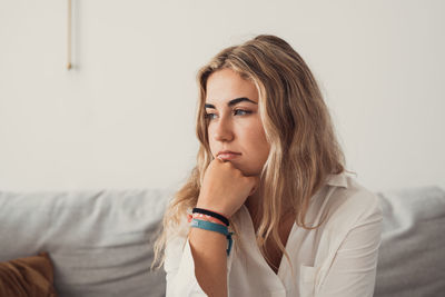 Portrait of young woman looking away