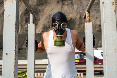 Portrait of man holding camera