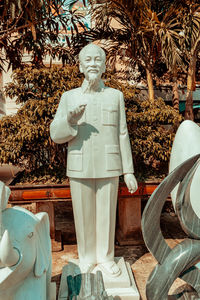 Statue of buddha against trees