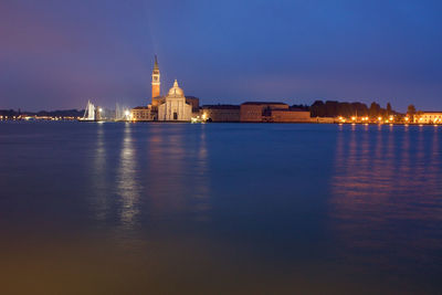 Reflection of illuminated buildings in water