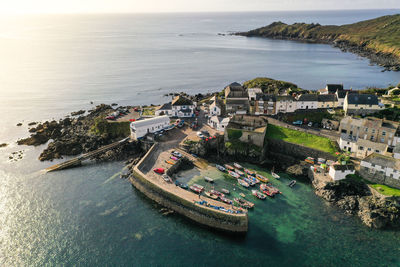An aerial view of the cornish fishing village of coverack and harbour