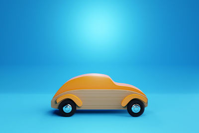 Close-up of toy car against blue background