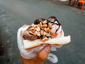 Close-up of hand holding ice cream