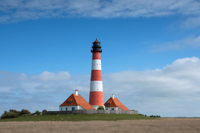 Panoramic image of westerhever lighthouse against sky, north frisia, germany