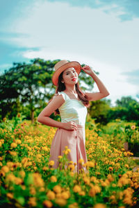 Full length of woman standing on field