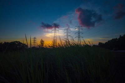 Scenic view of field against sky during sunset