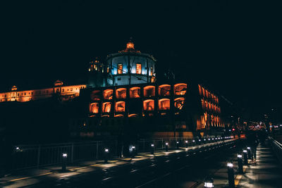 Illuminated buildings in city at night