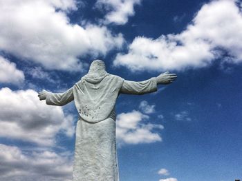 Low angle view of statue against blue sky