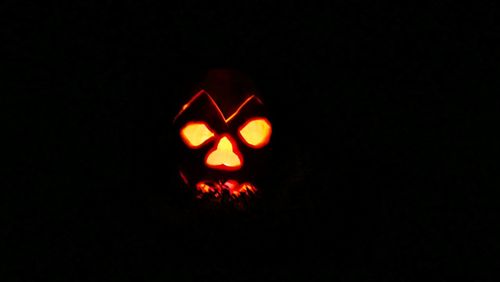 Close-up of illuminated pumpkin against black background