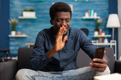 Young man using mobile phone