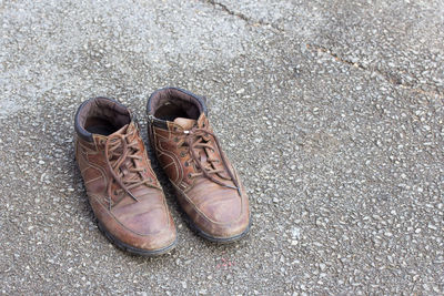 High angle view of shoes on road