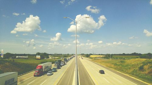 Road passing through dramatic sky