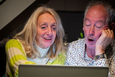 Portrait of woman using digital tablet at home