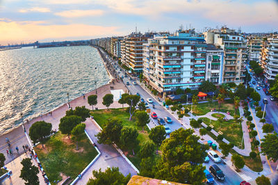 High angle view of buildings and sea against sky