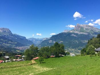 Scenic view of landscape and mountains against sky