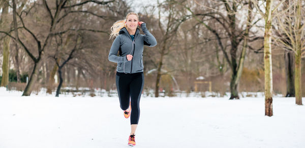 Full length of man running on snow