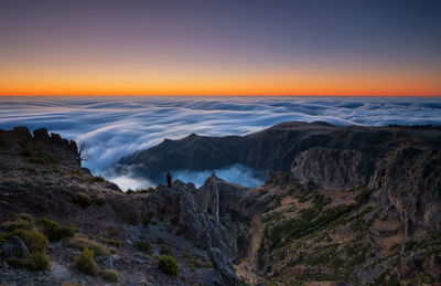 Scenic view of mountains against dramatic sky