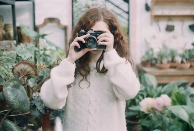 Woman photographing with camera