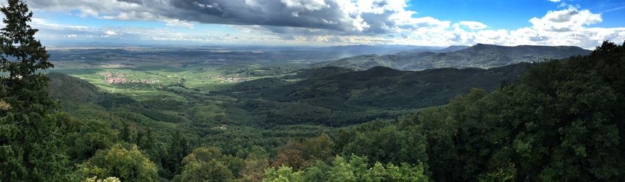 Scenic view of mountains against cloudy sky