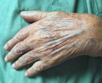 Close-up of hands on table