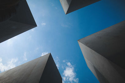 Directly below shot of buildings against sky