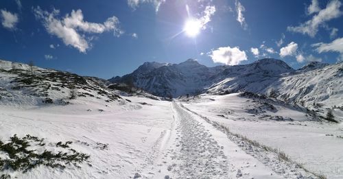 Scenic view of snowcapped mountains against sky