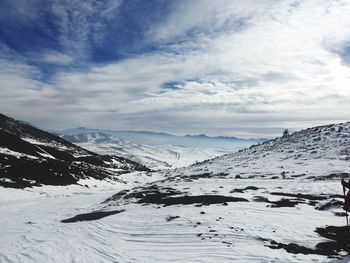 Scenic view of snowcapped mountains against sky