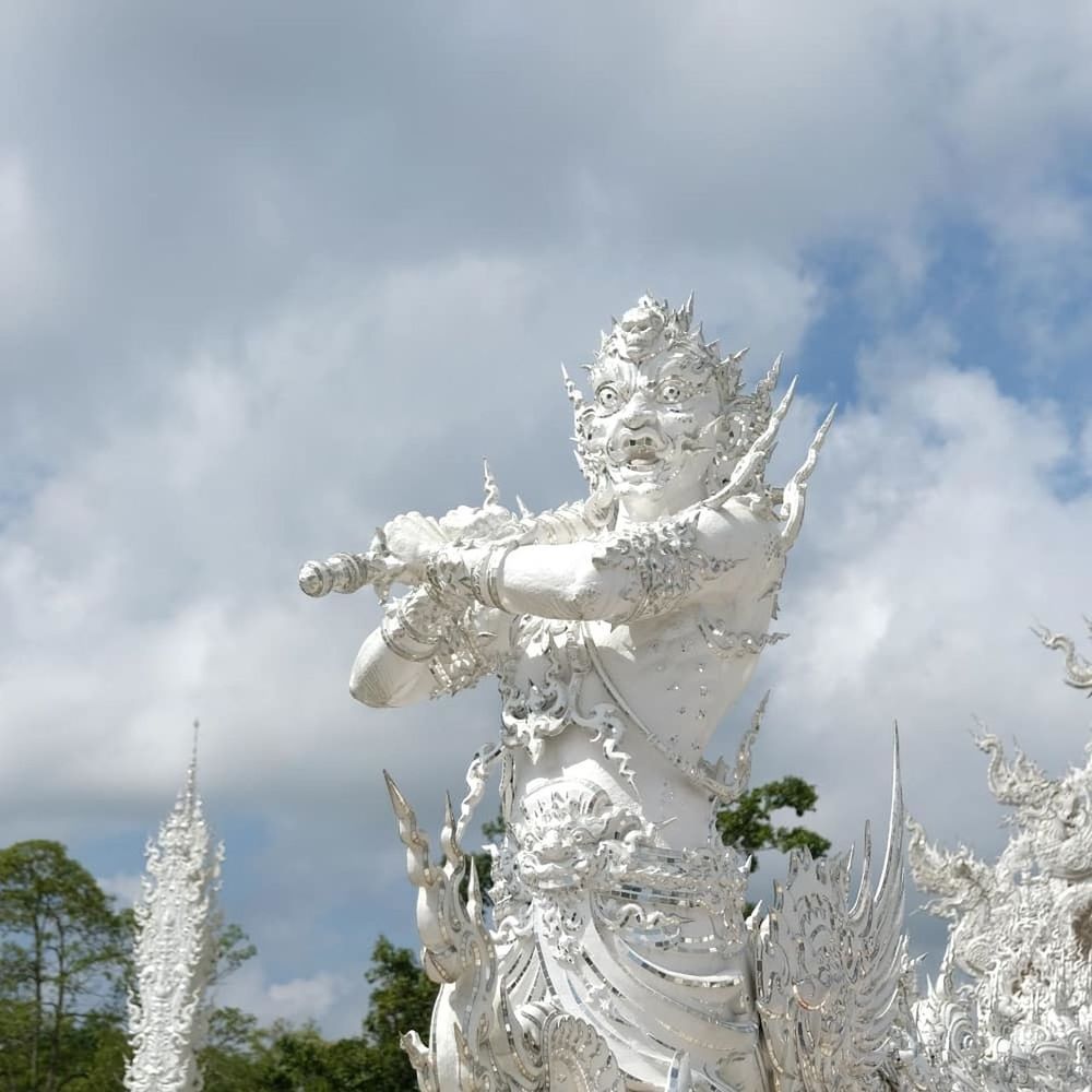 cloud - sky, sky, sculpture, statue, art and craft, day, human representation, representation, nature, no people, low angle view, creativity, female likeness, spirituality, religion, outdoors, white color, belief, plant, male likeness, angel