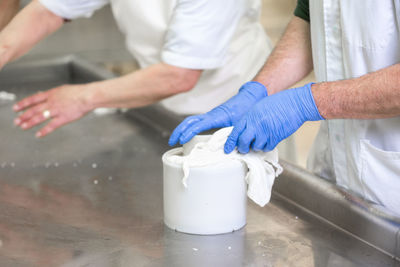 Midsection of man preparing food