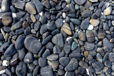 Full frame shot of pebbles at beach