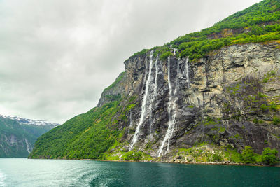 Geiranger fjord, norway, landscape with mountains and waterfalls seven sisters at summertime