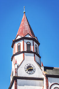 Low angle view of church against clear blue sky