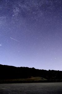 Scenic view of star field against sky at night