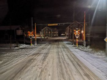 Blurred motion of illuminated street at night