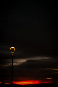 Low angle view of street light against sky during sunset