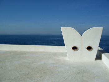 Scenic view of sea against blue sky