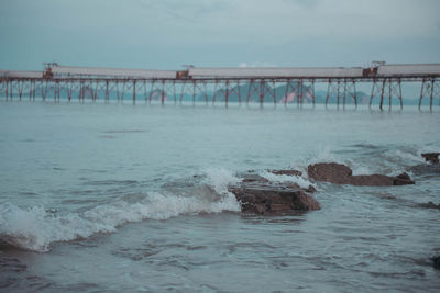 Pier over sea against sky