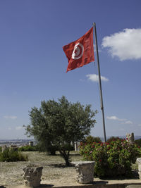 Low angle view of flag against sky