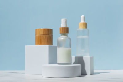 Close-up of beauty products against gray background