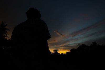 Low angle view of silhouette trees against sky at sunset