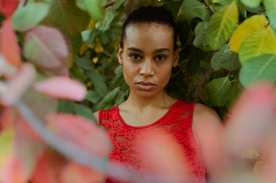 Portrait of young woman with leaves