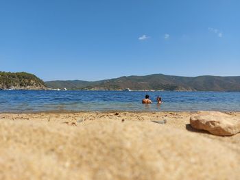Scenic view of sea against clear blue sky
