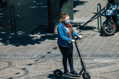 Full length of boy on street in city