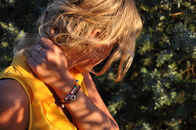 Side view close-up of woman with blond hair