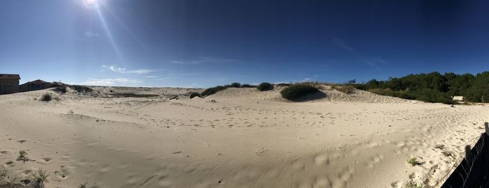 Panoramic view of desert against sky