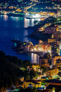 High angle view of illuminated buildings in city at night