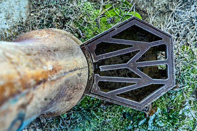 High angle view of old metal structure on field