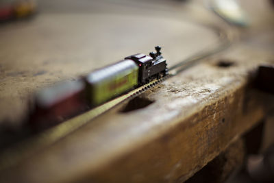 Close-up of old machine part on table