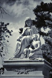 Low angle view of statue against sky